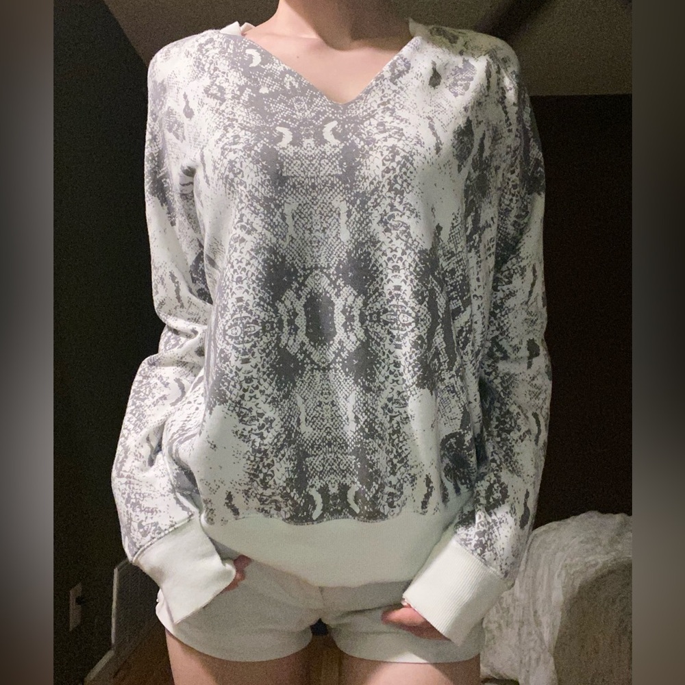 Grey and white snake print sweater.